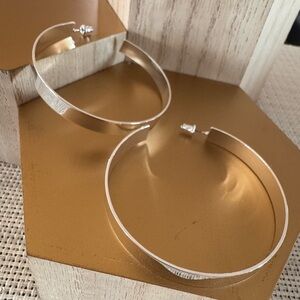 Flat white gold tone hoop earrings